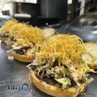 پیتزا و برگر زغالی دهکده